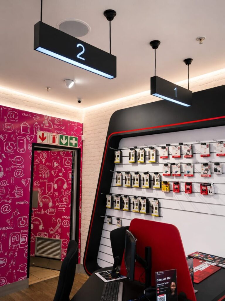 Consultant counter and accessories wall inside Vodacom 4U Cradlestone Mall